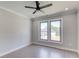 Bedroom with three windows, ceiling fan, recessed lighting and wood-look flooring at 37 Deer Canyon Dr, Auburn, GA 30011