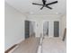 Neutral bedroom with fan, gray doors, and doorways leading to other rooms at 37 Deer Canyon Dr, Auburn, GA 30011