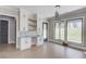 Bright bonus room with custom cabinets, open shelves, and large windows overlooking a spacious backyard at 37 Deer Canyon Dr, Auburn, GA 30011