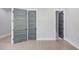 Hallway featuring modern gray doors and light wood flooring at 37 Deer Canyon Dr, Auburn, GA 30011