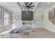Bright living room with coffered ceilings, custom shelving, and a modern ceiling fan at 37 Deer Canyon Dr, Auburn, GA 30011