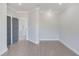 Living room with recessed lighting, wood-look flooring and an open doorway at 37 Deer Canyon Dr, Auburn, GA 30011