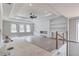Spacious living room features a fireplace, built-in shelves, and large windows for natural light at 37 Deer Canyon Dr, Auburn, GA 30011