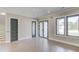 Spacious living room featuring large windows and multiple entryways providing ample natural light at 37 Deer Canyon Dr, Auburn, GA 30011