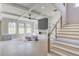 Bright living room with coffered ceilings, built-ins, fireplace, and ample natural light at 37 Deer Canyon Dr, Auburn, GA 30011