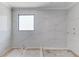Contemporary shower design with marble tile walls, rainfall showerhead, and window at 37 Deer Canyon Dr, Auburn, GA 30011
