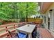Inviting back deck with comfortable outdoor seating and view of backyard is perfect for entertaining at 5574 Wynhall Dr, Peachtree Corners, GA 30071