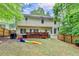 Lovely backyard with a wooden deck and playset creating a relaxing and fun outdoor space at 5574 Wynhall Dr, Peachtree Corners, GA 30071