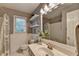 Well-lit bathroom features a toilet, vanity, and a shower with a decorative shower curtain for a clean, inviting ambiance at 5574 Wynhall Dr, Peachtree Corners, GA 30071