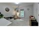 Cozy ' bedroom with a toddler bed, sunny window, and neutral paint at 5574 Wynhall Dr, Peachtree Corners, GA 30071