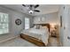 Inviting bedroom with neutral walls, a ceiling fan, and natural light creating a relaxing and peaceful atmosphere at 5574 Wynhall Dr, Peachtree Corners, GA 30071