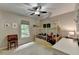 Charming bedroom with unique house-frame bed, ceiling fan, and a sunny window at 5574 Wynhall Dr, Peachtree Corners, GA 30071