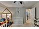 Well-lit bedroom with house-frame bed, ceiling fan, and neutral decor at 5574 Wynhall Dr, Peachtree Corners, GA 30071