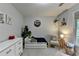 Charming ' bedroom with a toddler bed, chair, and neutral decor at 5574 Wynhall Dr, Peachtree Corners, GA 30071