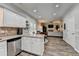 Eat-in kitchen with stainless steel appliances, granite countertops, and a view to the living room at 5574 Wynhall Dr, Peachtree Corners, GA 30071