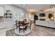 Eat-in kitchen with white cabinets, stainless steel appliances, granite countertops, and a breakfast nook at 5574 Wynhall Dr, Peachtree Corners, GA 30071