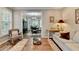 Cozy living room featuring a fireplace and an open view into the elegant dining space at 5574 Wynhall Dr, Peachtree Corners, GA 30071