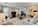 Bright and airy living room with neutral décor and a seamless flow to the dining area at 5574 Wynhall Dr, Peachtree Corners, GA 30071