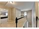 Hallway showing access to rooms, featuring neutral paint, carpeting and white railings at 5574 Wynhall Dr, Peachtree Corners, GA 30071