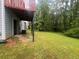 Backyard featuring a well-maintained lawn, and partial view of a raised back deck at 5769 Shadow Creek Dr, Lithonia, GA 30058