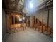 Unfinished basement featuring exposed framing and concrete flooring, offering potential for customization at 5769 Shadow Creek Dr, Lithonia, GA 30058
