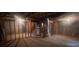 Unfinished basement featuring exposed framing and concrete flooring, offering potential for customization at 5769 Shadow Creek Dr, Lithonia, GA 30058