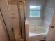 Bathroom with a walk-in shower and a large soaking tub with jets at 5769 Shadow Creek Dr, Lithonia, GA 30058