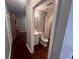 Bathroom view features a white vanity, toilet, mirror, and a view towards the toilet at 5769 Shadow Creek Dr, Lithonia, GA 30058