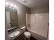 Bathroom featuring vanity with granite countertop, toilet, and bathtub with showerhead at 5769 Shadow Creek Dr, Lithonia, GA 30058