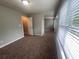 Bedroom with a ceiling fan and large windows bring in lots of natural light at 5769 Shadow Creek Dr, Lithonia, GA 30058