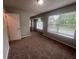 Bedroom with a ceiling fan and large windows bring in lots of natural light at 5769 Shadow Creek Dr, Lithonia, GA 30058