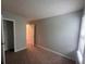 A spacious bedroom with neutral-toned walls and plush carpeting offers a calming atmosphere at 5769 Shadow Creek Dr, Lithonia, GA 30058