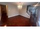 Cozy dining room with hardwood floors, view to the staircase, and neutral decor at 5769 Shadow Creek Dr, Lithonia, GA 30058