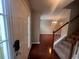 Inviting foyer with hardwood floors, a stairway, and natural light shining in at 5769 Shadow Creek Dr, Lithonia, GA 30058