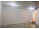 View of a spacious garage with painted walls, lights and a passage to a doorway at 5769 Shadow Creek Dr, Lithonia, GA 30058