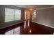 Living room featuring large windows, hardwood floors, and ample natural light at 5769 Shadow Creek Dr, Lithonia, GA 30058