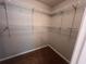 Spacious walk-in closet featuring wire shelving for optimal storage and organization in neutral color scheme at 5769 Shadow Creek Dr, Lithonia, GA 30058