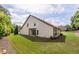 Large backyard area with grass, landscaping, patio, and a view of the home's exterior at 1355 Hesse Ln, Austell, GA 30106