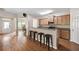 Open kitchen featuring a breakfast bar with seating, granite countertops, and stainless steel appliances at 1355 Hesse Ln, Austell, GA 30106