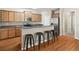 Open kitchen featuring a breakfast bar with seating, granite countertops, and stainless steel appliances at 1355 Hesse Ln, Austell, GA 30106