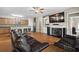Open concept living area featuring hardwood floors, a fireplace, and adjacent kitchen with breakfast bar at 1355 Hesse Ln, Austell, GA 30106