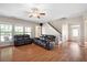 Inviting living room featuring hardwood floors, neutral paint, and ample natural light at 1355 Hesse Ln, Austell, GA 30106