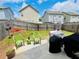 The backyard features a concrete patio with outdoor seating and well-maintained grass at 24 Samuel Nw Way, Cartersville, GA 30121