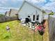 Charming backyard features a patio, string lights, and a well-maintained lawn, perfect for outdoor entertaining at 24 Samuel Nw Way, Cartersville, GA 30121