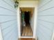 Inviting entryway with a light-colored door and sidelight, leading to a home's interior hallway at 24 Samuel Nw Way, Cartersville, GA 30121