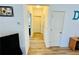 Hallway with modern flooring, neutral paint, and access to multiple rooms within the home at 24 Samuel Nw Way, Cartersville, GA 30121