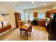 Bright eat-in kitchen with modern appliances, wooden cabinets, and a sunny dining area by the window at 24 Samuel Nw Way, Cartersville, GA 30121