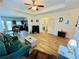 Open-concept living room with modern flooring, a cozy seating area, and a view of the kitchen at 24 Samuel Nw Way, Cartersville, GA 30121