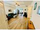 Comfortable living room with an open floor plan, light wood floors, and access to the dining area at 24 Samuel Nw Way, Cartersville, GA 30121