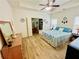Bright main bedroom with a ceiling fan, wood floors, and an ensuite bathroom at 24 Samuel Nw Way, Cartersville, GA 30121